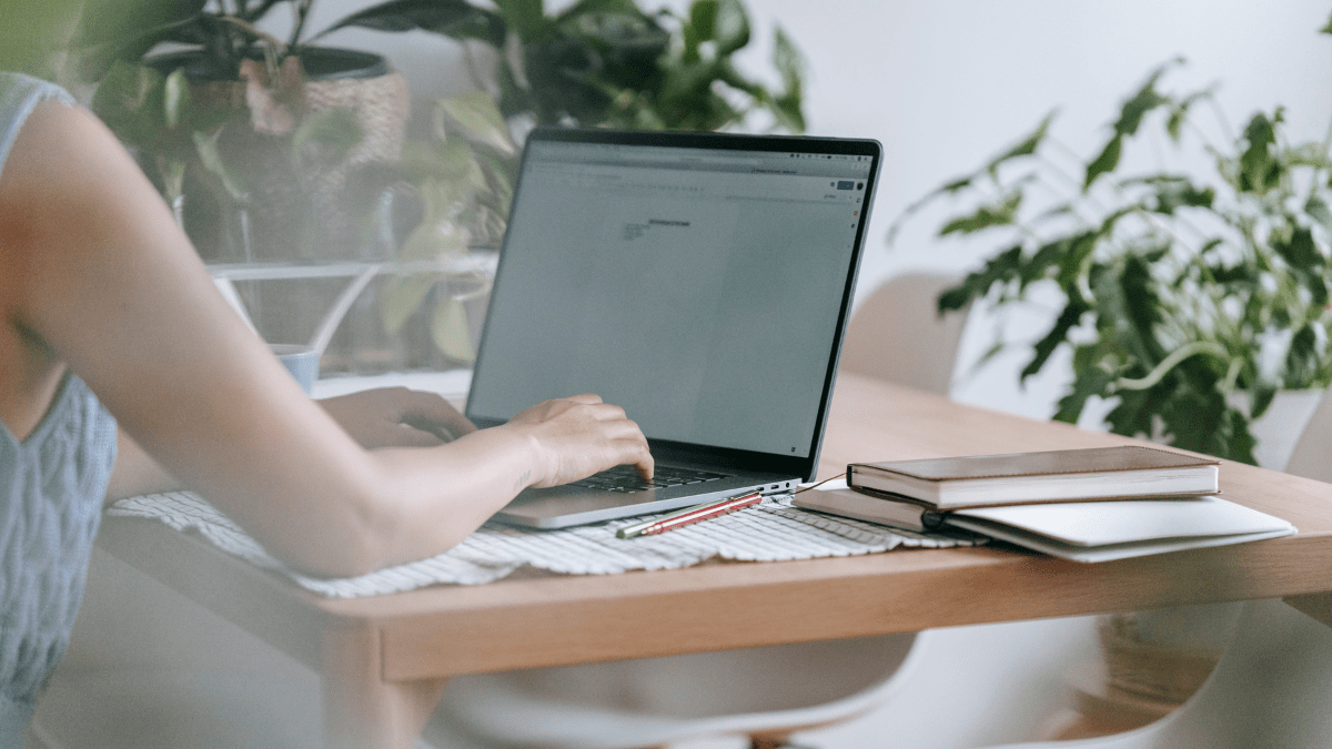 Woman working on laptop at home